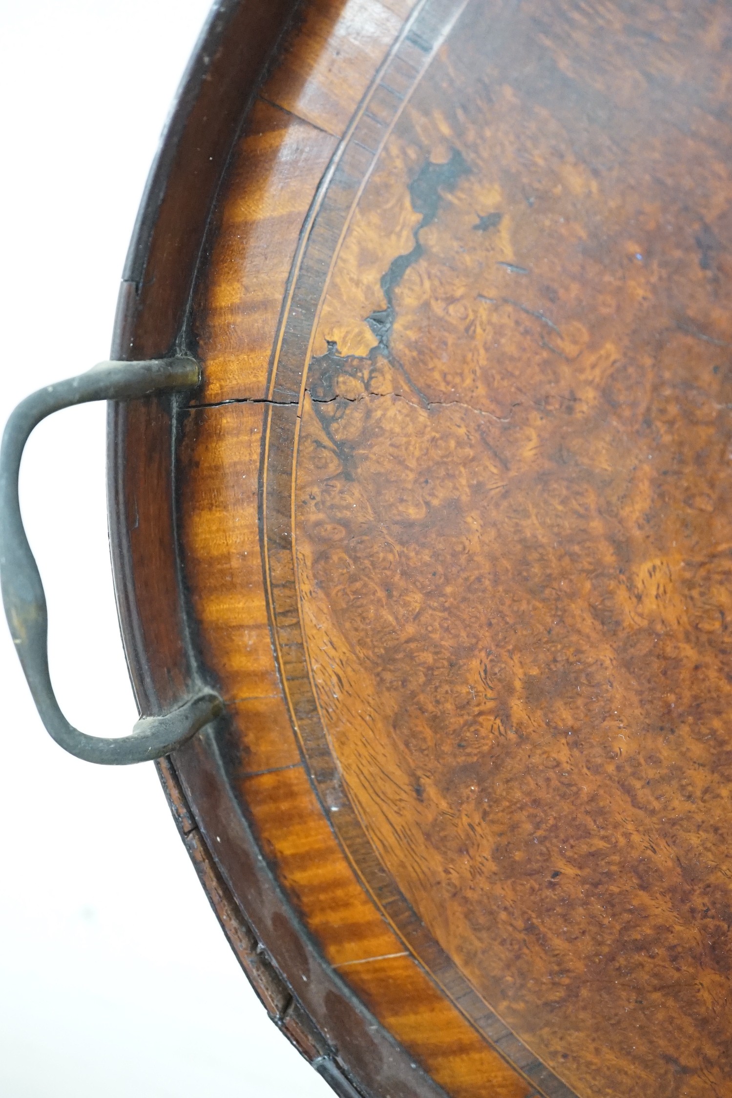 A burr walnut oval, two handled tray, 72cms wide